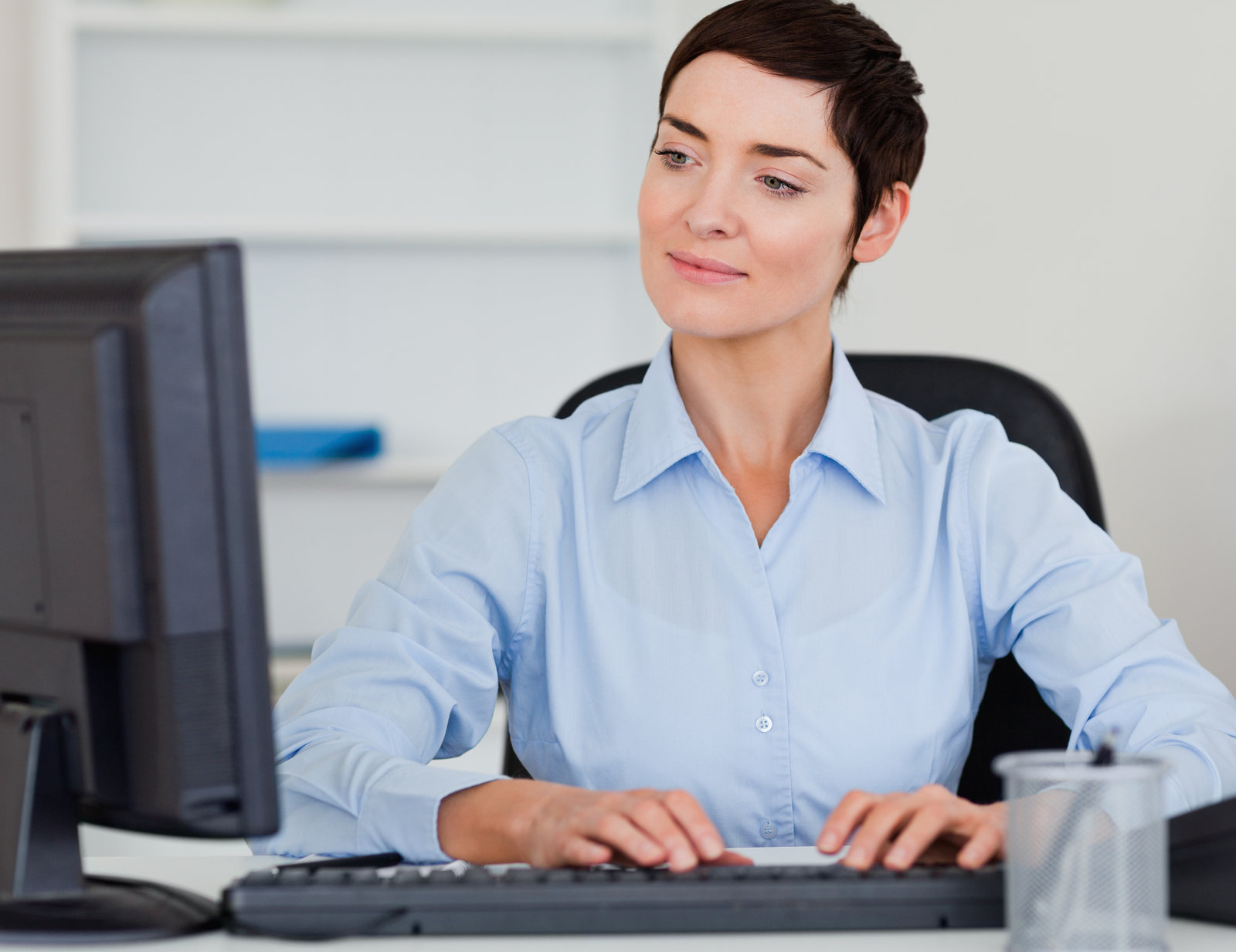 cute businesswoman typing with her computer